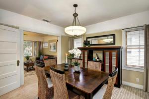 a dining room with a wooden table and chairs at Charming 2Bed French Colonial Apartment in Desirable Midtown Sacramento in Sacramento