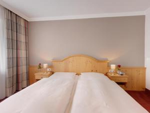 Postel nebo postele na pokoji v ubytování Hotel Heigl