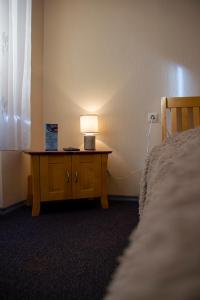 Säng eller sängar i ett rum på Olimpija Hotel & SPA