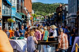 a crowd of people walking down a busy street at Park City Getaway in Park City