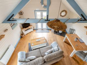 an overhead view of a living room with a couch and a table at The Nook in Louth