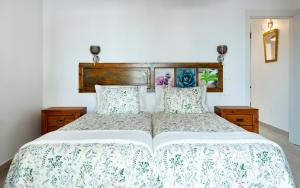 Postel nebo postele na pokoji v ubytování CASA ISABEL