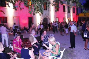 a group of people sitting in front of a building at Agriturismo Il Palazzone in Montegalda