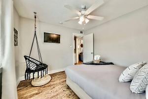 a bedroom with a bed and a ceiling fan at Lovely Dallas Flat Near Downtown in Dallas