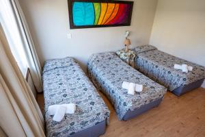 Letto o letti in una camera di Hotel Park Bariloche