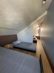 a small room with a bed in a room at Duplex Côté Mer in Filaos
