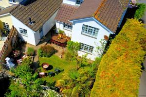 an aerial view of a house with a yard at CROYDE WHITE HOUSE 4 Bedrooms in Croyde