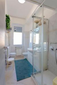 a bathroom with a shower and a sink and a toilet at La reggia del mar - Genova Sturla, mare e Gaslini in Genova