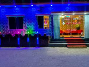 a building with a seafood restaurant with blue lights at Sea Front Resort in Cox's Bazar