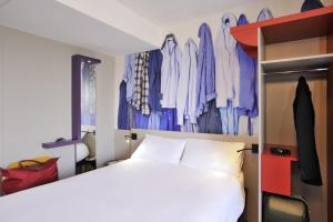Postel nebo postele na pokoji v ubytování ibis Styles Lille Centre Grand Place