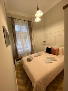 A bed or beds in a room at PJ apartment