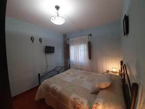 A bed or beds in a room at Apartamentos Esqueiro
