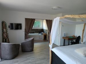 a bedroom with a bed and a bathroom at séjour bien-être balnéothérapie en vallée heureuse à Sorede in Sorède