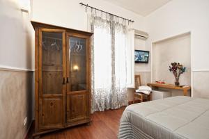 A bed or beds in a room at Romacentrarte