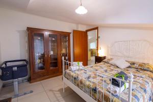 a bedroom with a bed and a tv in it at B&B delle Meraviglie Salerno Hills in Pellezzano