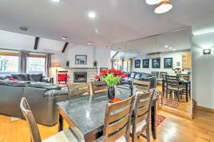 a dining room and living room with a table at Fantastic Tannersville Townhome with Epic Views in Tannersville