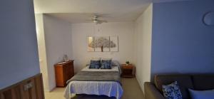 a bedroom with a bed and a couch at Green Park in San Miguel de Abona +17 photos