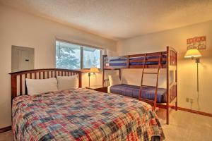 a bedroom with a bed and a bunk bed at Ski, Hike and Explore All-Season Frisco Condo in Frisco