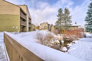 a yard covered in snow next to a house at Ski, Hike and Explore All-Season Frisco Condo in Frisco