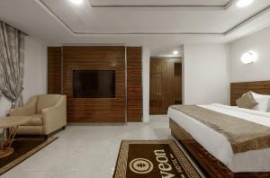 Postel nebo postele na pokoji v ubytování Aveon Hotel