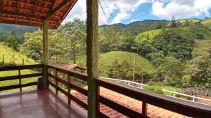 a view from the balcony of a house in the mountains at Chale vista verde in São José dos Campos