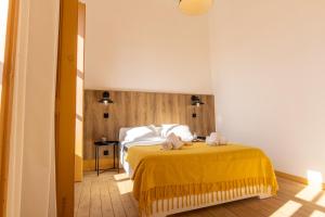 En eller flere senge i et værelse på GrowIN Digital Nomads