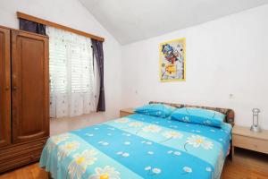 Postel nebo postele na pokoji v ubytování Apartments by the sea Vinisce, Trogir - 13648