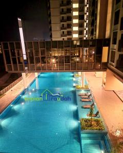 a large swimming pool on top of a building at Bali Residence Impian Raudah in Melaka