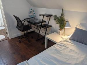 a bedroom with a desk and a chair and a bed at Northwest Retreat with Cedar Hot Tub in Seattle