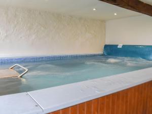 a large pool of water in a room at The Loft - Ukc6139 in Cartmel