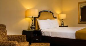 Ein Bett oder Betten in einem Zimmer der Unterkunft Torre Venezia Suites