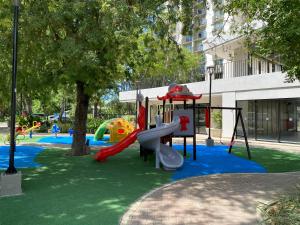 a playground with a slide in a park at Apartment near to Bello Horizonte Beach, Santa Marta Airport in Santa Marta