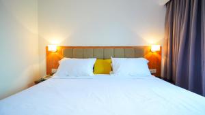 Postel nebo postele na pokoji v ubytování D Loft Hotel