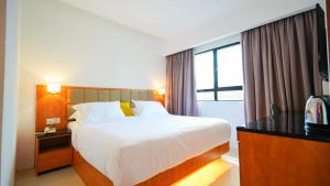 Postel nebo postele na pokoji v ubytování D Loft Hotel