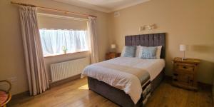 Ein Bett oder Betten in einem Zimmer der Unterkunft LittleField B&B Durrow, Laois