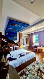 Postel nebo postele na pokoji v ubytování Dream Palace Resort + 37 fotografií