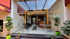 an entrance to a building with a glass door at Hotel Central Avenue in Sangli