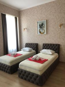 Postel nebo postele na pokoji v ubytování Hotel Guri