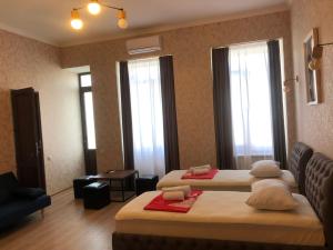 Postel nebo postele na pokoji v ubytování Hotel Guri