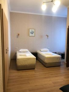 Postel nebo postele na pokoji v ubytování Hotel Guri