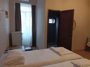 Postel nebo postele na pokoji v ubytování Hotel Guri