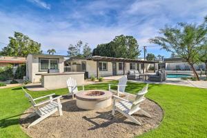 a yard with two chairs and a fire pit at Less Than 1 Mi to El Paseo Cottage Oasis with Fire Pit in Palm Desert