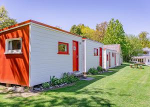 a row of tiny houses in a yard at Mount Cook Station Huts in Lake Tekapo