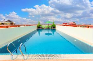 a swimming pool on the roof of a building at Cheathata CTS Hotel Siem Reap in Siem Reap