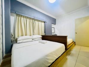 Ένα ή περισσότερα κρεβάτια σε δωμάτιο στο Selat Horizon Condominium by Myplace