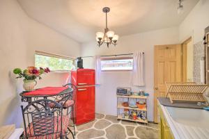 a kitchen with an old red refrigerator in a room at Quirky Santa Cruz Studio with Shared Hot Tub! in Santa Cruz