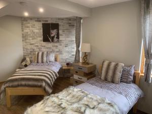 A bed or beds in a room at House Proctor