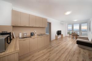 A cozinha ou cozinha compacta de Moana Lighthouse Apartment