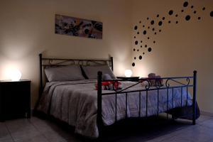 a bedroom with a bed with two stuffed animals on it at B&B a Capua - I PORTICI del centro in Capua