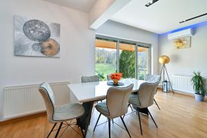 a dining room with a table and chairs at Holiday Home Hanna Toplice Sveti Martin in Sveti Martin na Muri
